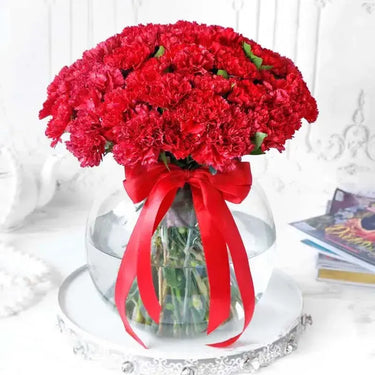 Red Carnation Delight, Blooms in a Fish Bowl, 50 Red Carnations, Green Leaves, Glass Vase, Ribbon Bow